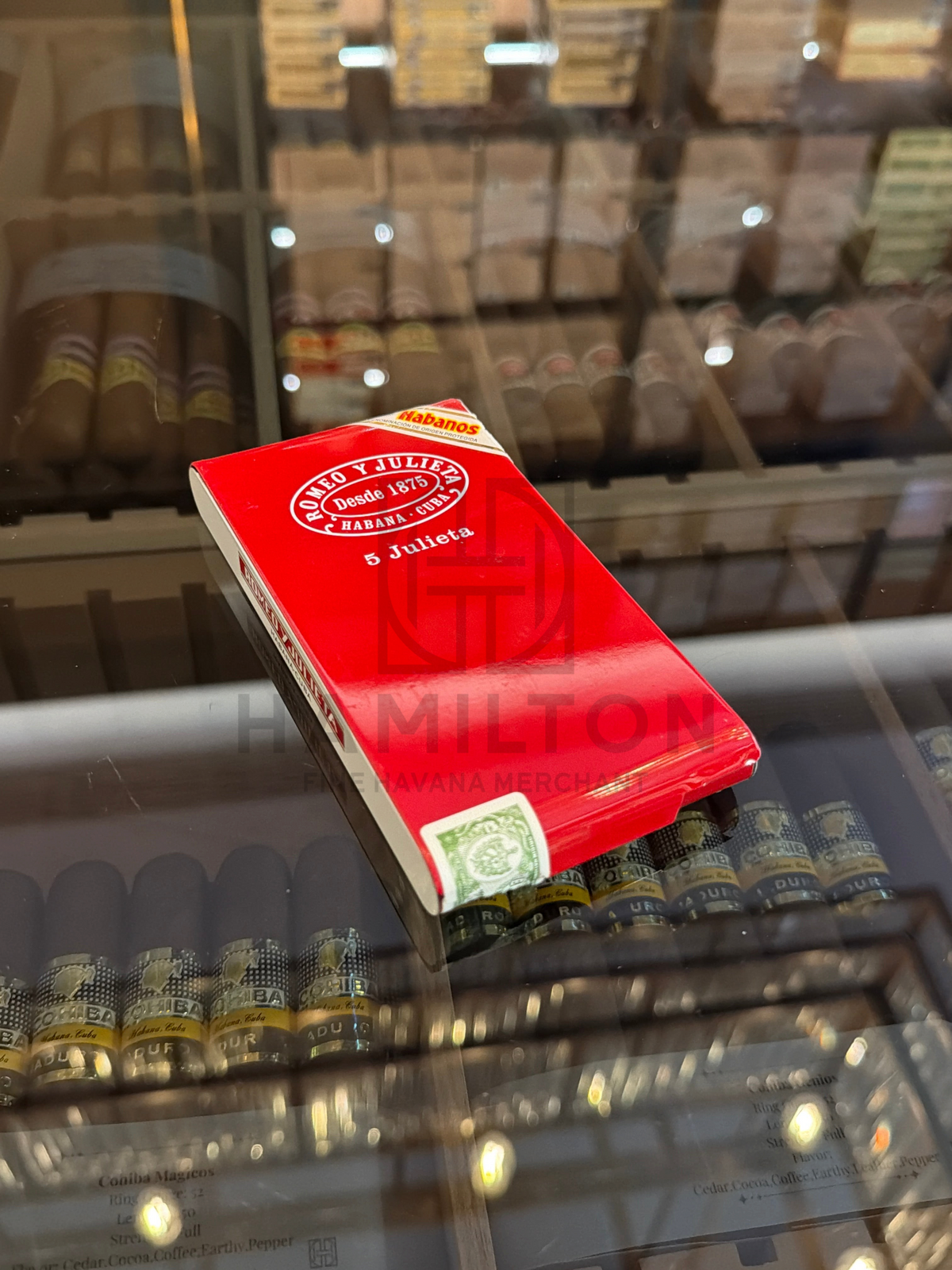 HAMILTON Romeo y Julieta 5 Julieta cigar tin in vibrant red packaging with Habanos seal on a glass display shelf