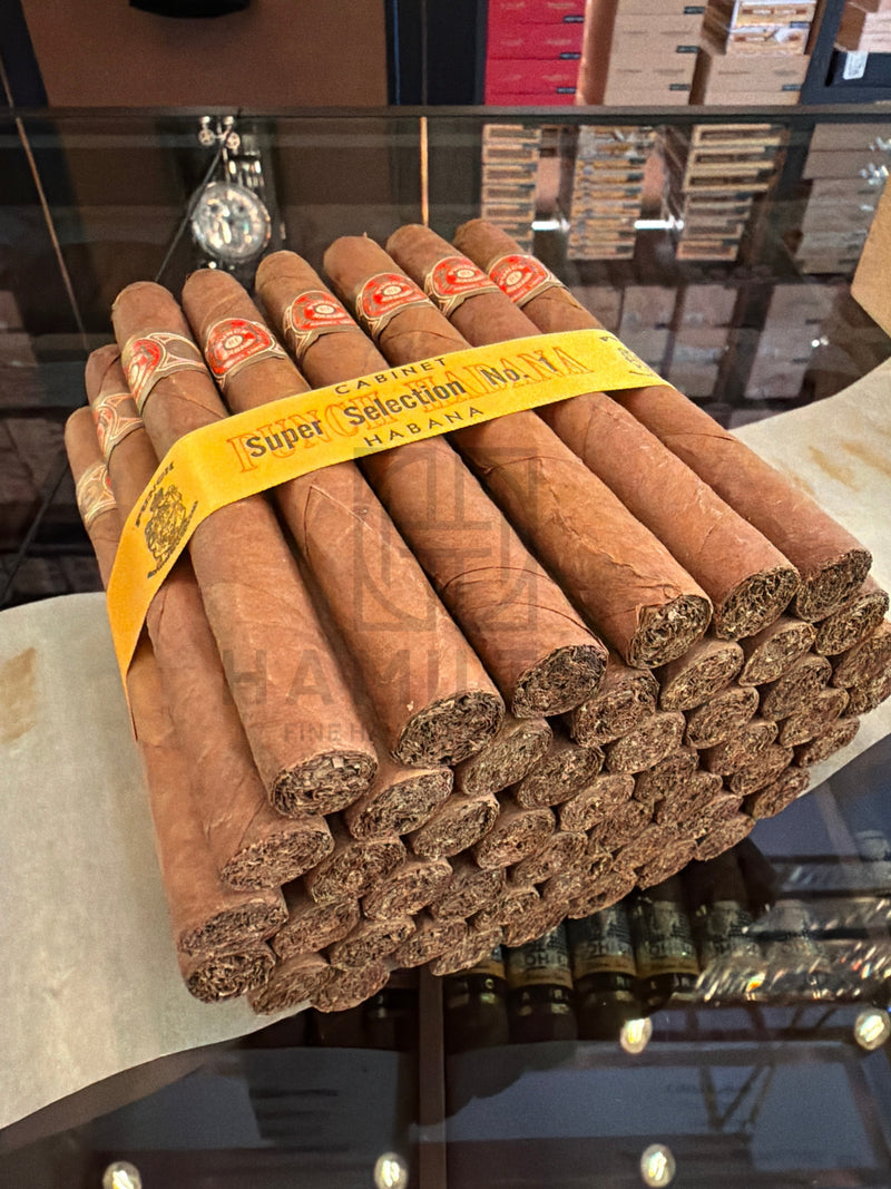 HAMILTON Punch 50s Super Selection No.1 2008 cigars in a bundle with yellow paper band on a glass display shelf