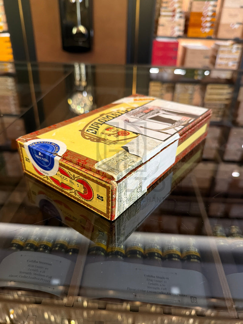HAMILTON vintage Diplomaticos No. 5 cigar box from 2002 with classic yellow and red branding on a glass display case