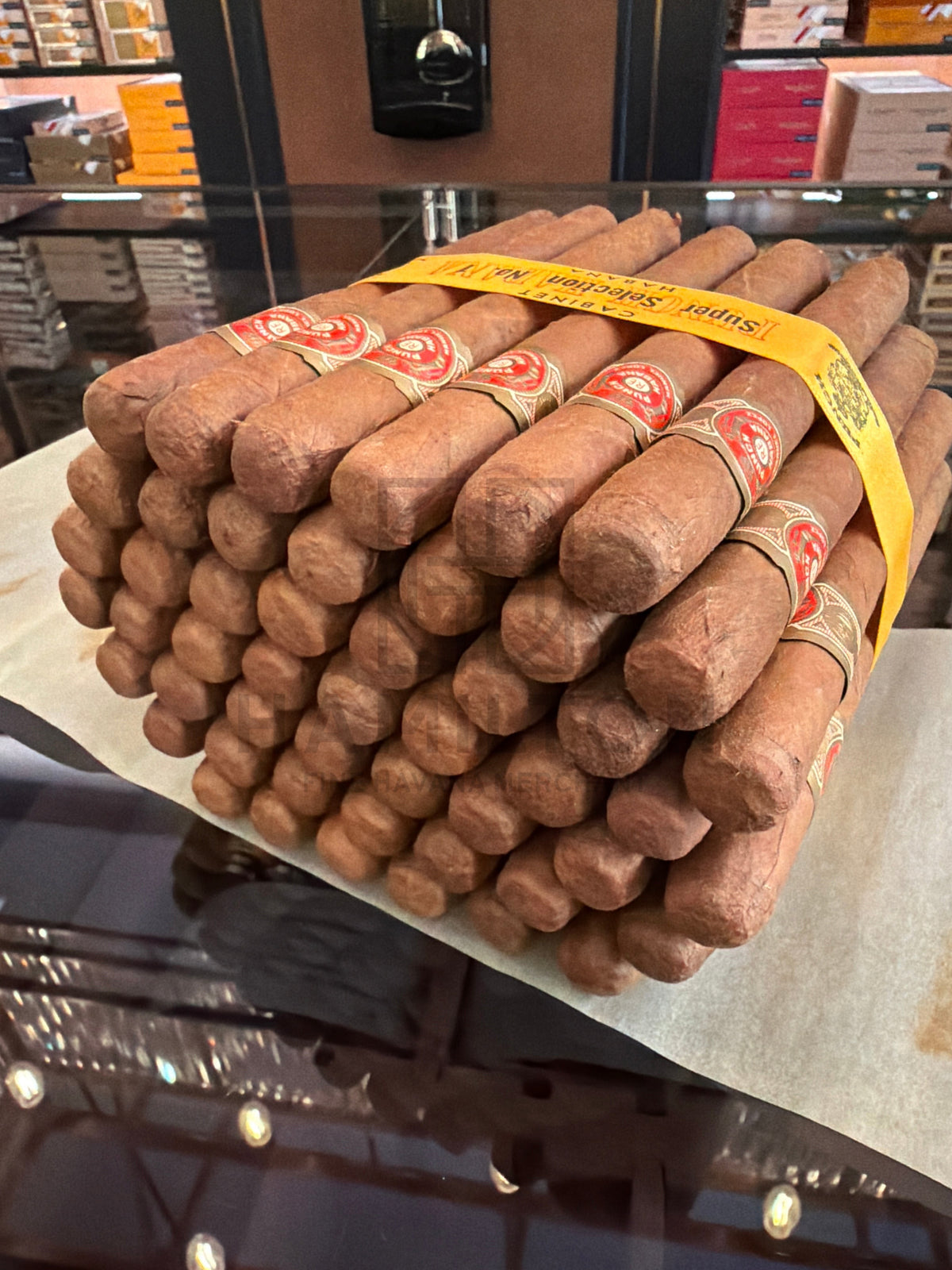 HAMILTON Punch 50s Super Selection No.1 2008 cigars stacked in a wooden cabinet with yellow paper bands