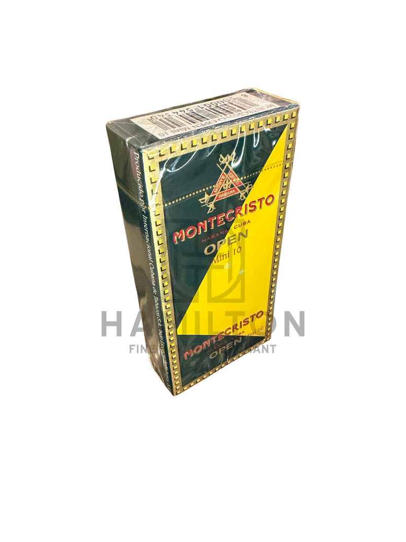 HAMILTON MONTECRISTO Open Mini cigar pack in green and yellow packaging displayed inside a glass humidor case